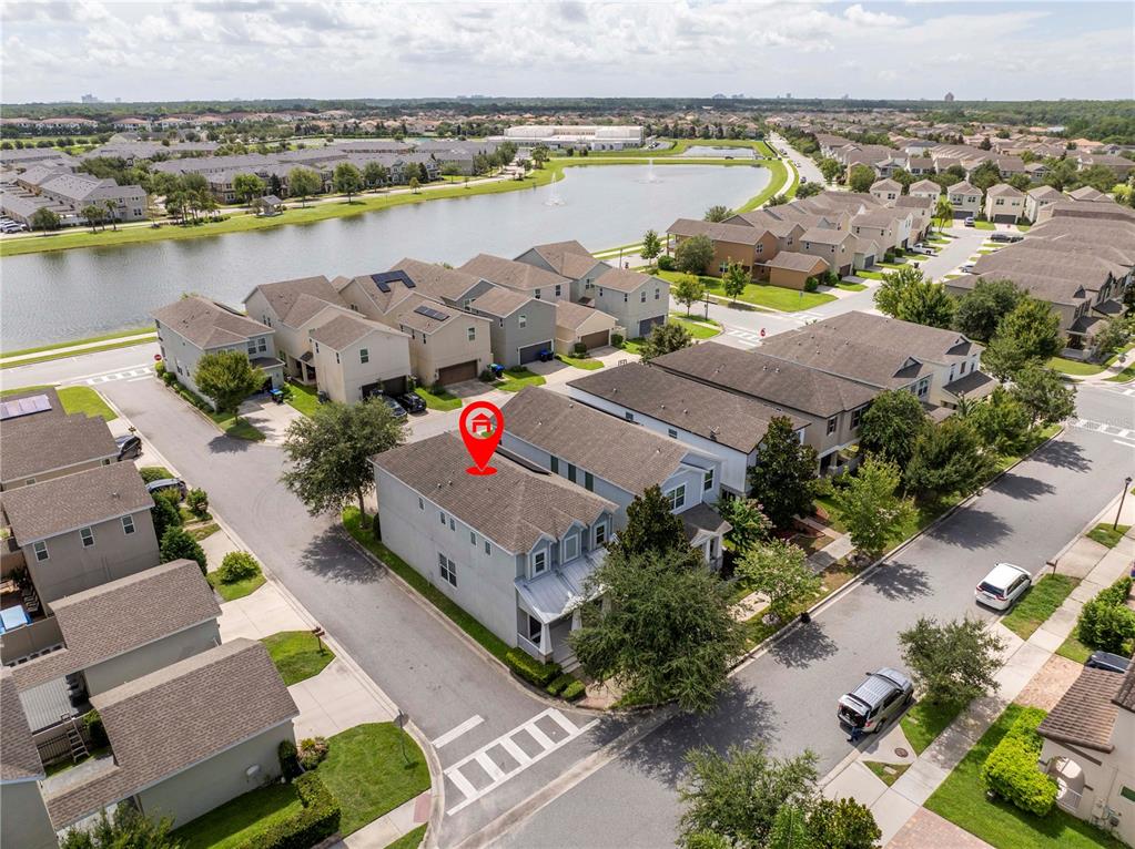 An aerial view shows a two-story residential house marked with a red location pin — 8225 BRYCE CANYON AVENUE, WINDERMERE, FL