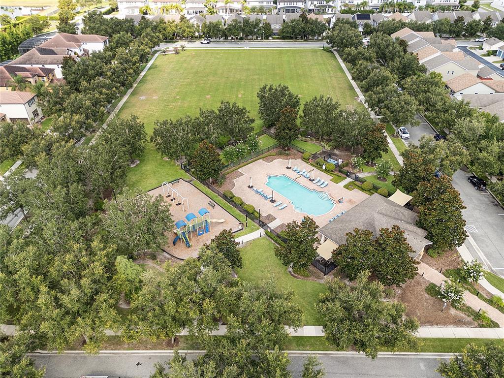 An aerial view shows a two-story house with a tiled roof and paved driveway — 6152 GOLDEN DEWDROP TRAIL, WINDERMERE, FL