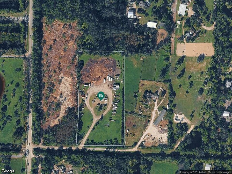 An aerial view shows a rural property with a circular driveway and several parked vehicles — 9895 N 165th Street N, Jupiter FL 33478, JUPITER, FL