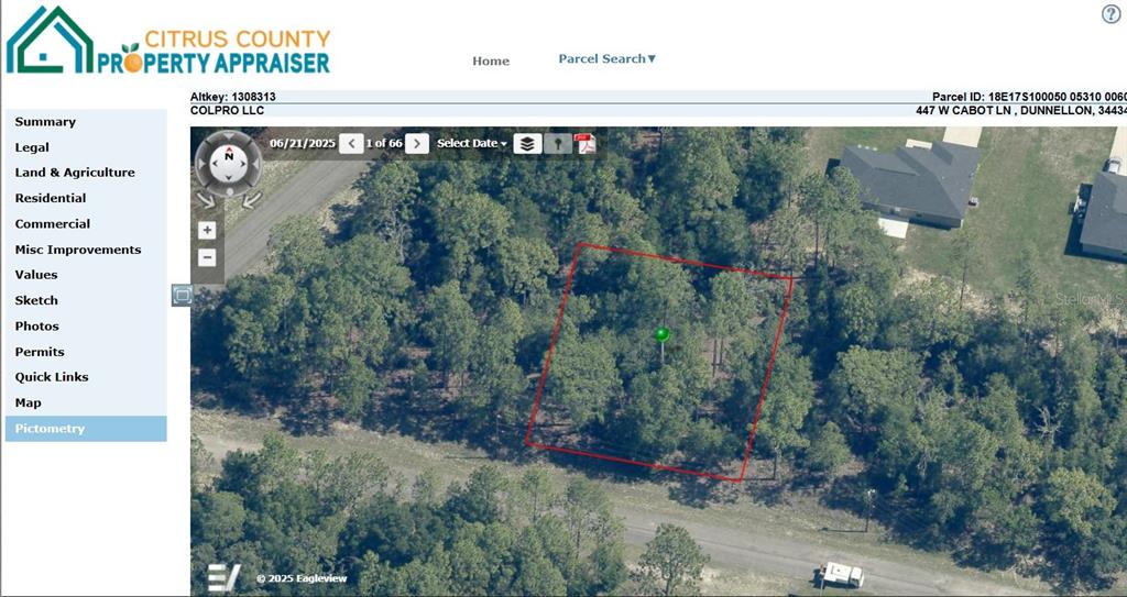 An aerial view shows a wooded, undeveloped rectangular lot outlined in red — 447 W CABOT LANE, DUNNELLON, FL