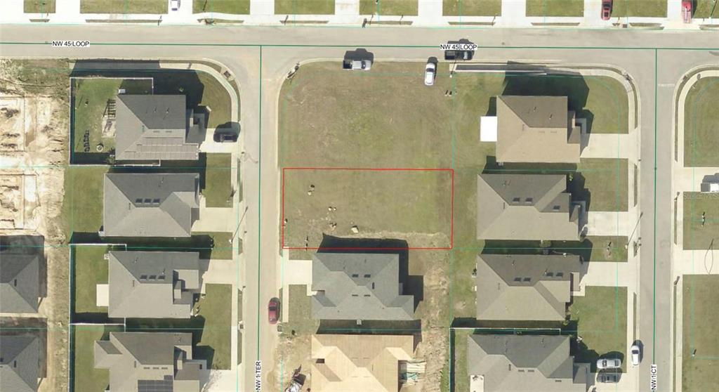 This aerial view shows a vacant residential lot outlined in red within a suburban neighborhood — 4537 NW 1ST TERRACE, OCALA, FL