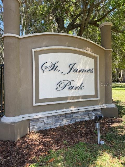 A beige monument sign with stone accents displays the name St. James Park — 4537 NW 1ST TERRACE, OCALA, FL