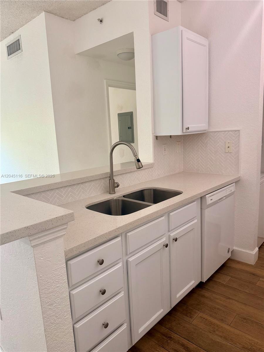 An empty room with light wood floors, a ceiling fan, and a sliding glass door — 6001 SW 70th St # 355, South Miami FL 33143, SOUTH MIAMI, FL