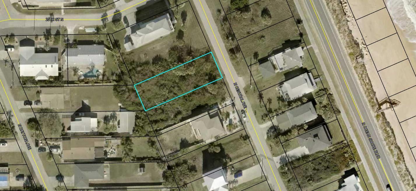 This is an aerial map view of a vacant, rectangular lot highlighted in blue — 1945 N Central Avenue, FL 32136, FL