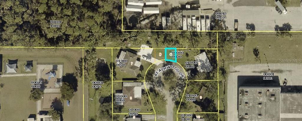 This is an aerial map showing a residential lot highlighted in blue on Beachwood Drive — 1826 BEACHWOOD DRIVE, NORTH FORT MYERS, FL
