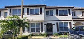 A two-story residential building with white stucco walls, dark window frames, and a tiled roof — 8715 SW 152nd Ave # 312, Miami FL 33193, MIAMI, FL