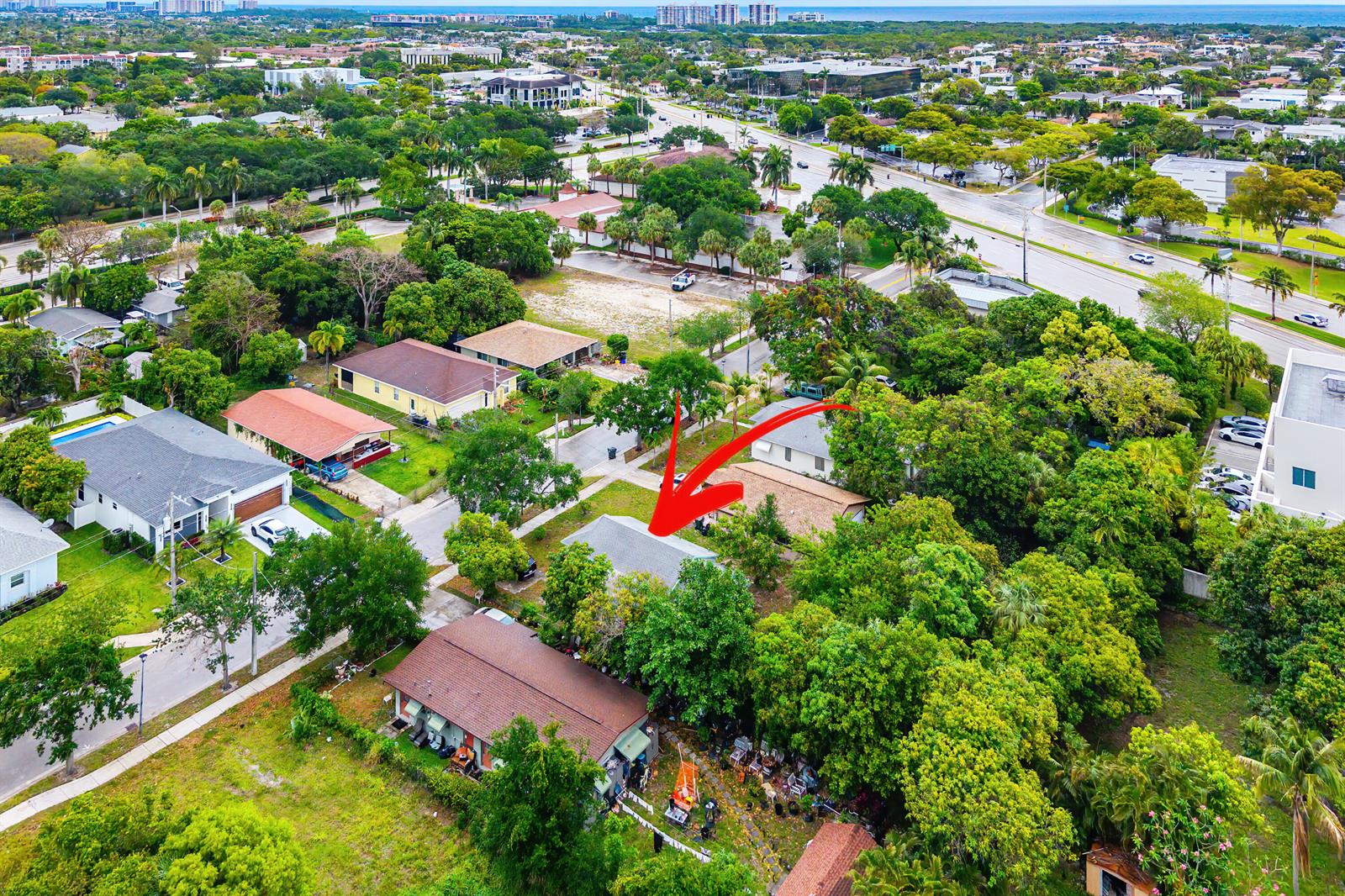 An aerial view shows a single-story house with a gray roof surrounded by lush trees — 156 Pearl Street, Boca Raton FL 33432, BOCA RATON, FL