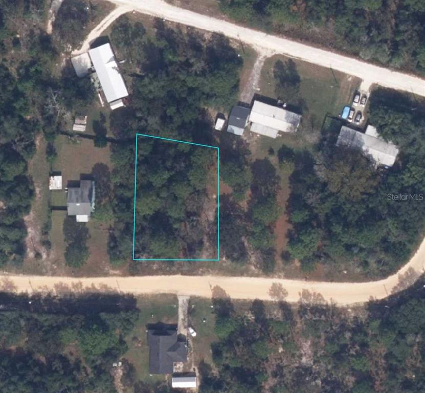 An aerial view shows a vacant, wooded rectangular lot outlined in blue between two roads — 5814 HILLRIDGE ROAD, KEYSTONE HEIGHTS, FL