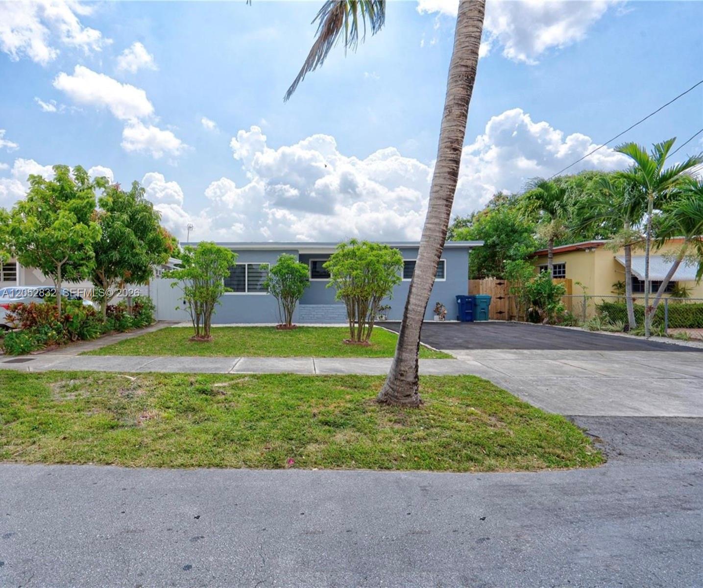 A single-story gray house features a front lawn, a palm tree, and a paved driveway — 3635 SW 88th Ct, Miami FL 33165, MIAMI, FL