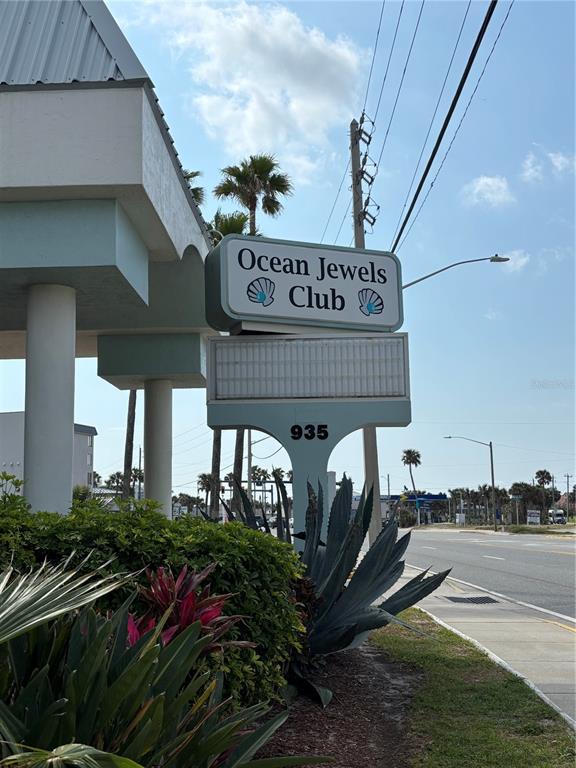 A sign for the Ocean Jewels Club stands in front of a building near a road — 935 S ATLANTIC AVENUE UNIT 364, DAYTONA BEACH, FL