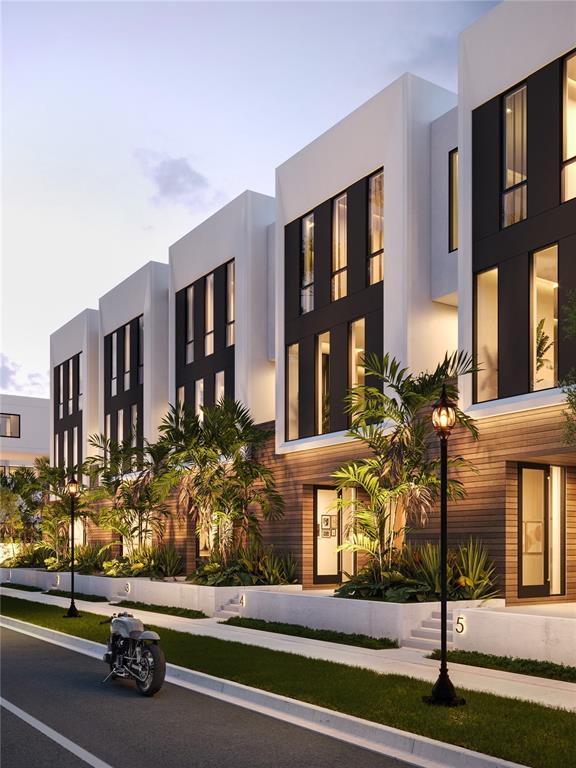 A rendering of a row of modern townhouses with white facades, dark windows, and palm landscaping — 1625 4TH STREET, SARASOTA, FL