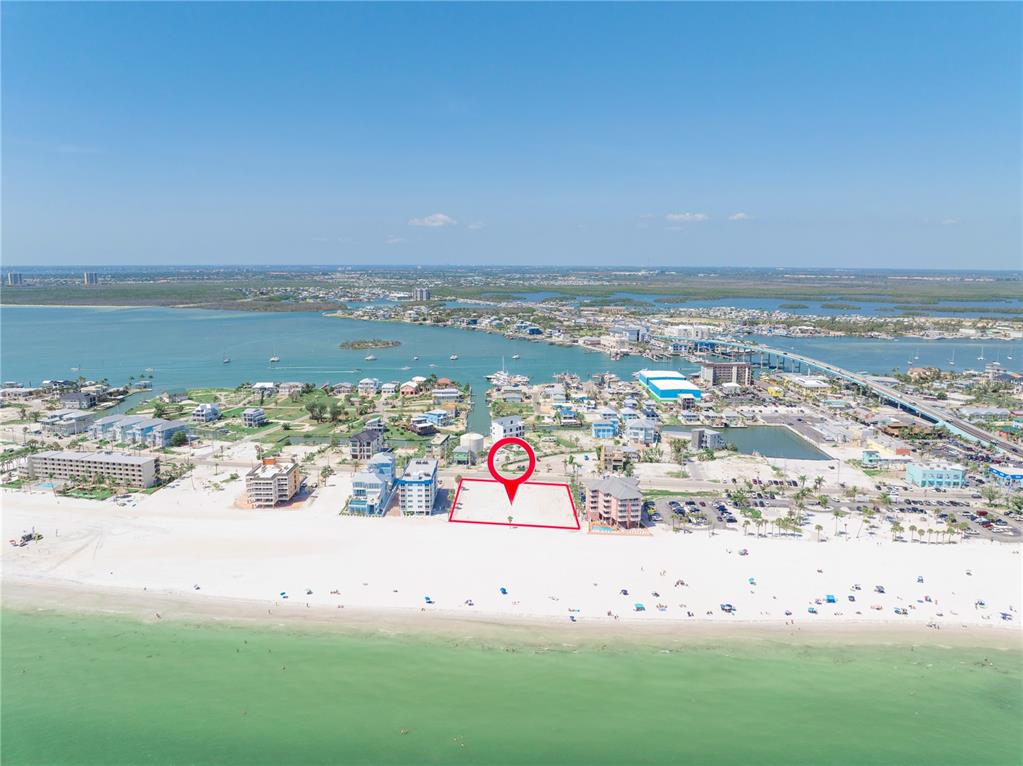 An aerial view shows a vacant beachfront lot outlined in red on a sandy shore — 800-802 ESTERO BOULEVARD, FORT MYERS BEACH, FL