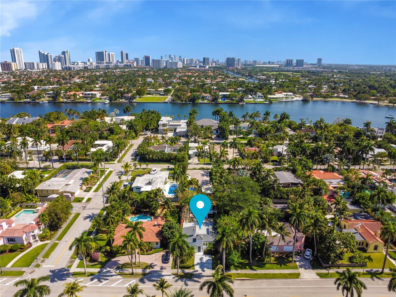An aerial view shows a residential neighborhood with a blue location pin over a house — 1108 Harrison St, Hollywood FL 33019, HOLLYWOOD, FL