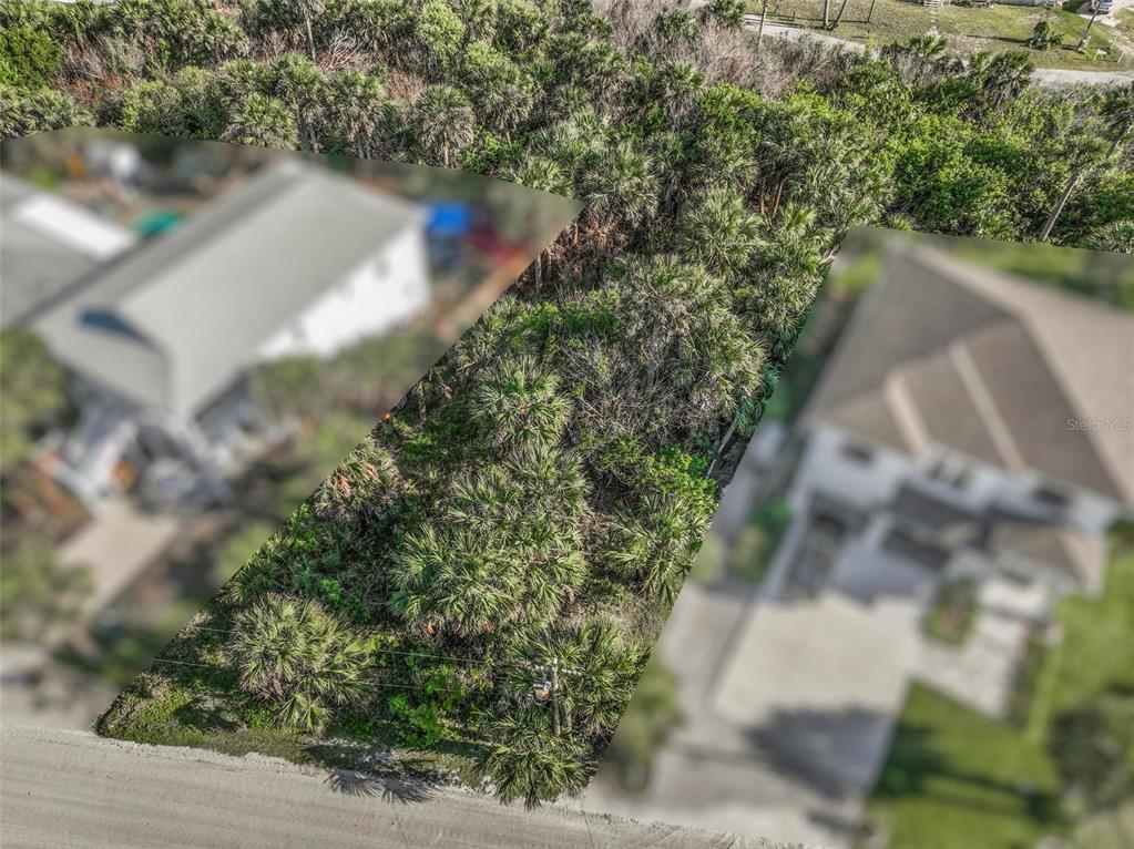 An aerial view shows a vacant, tree-covered lot situated between two residential houses — 16 WESTMAYER PLACE, FLAGLER BEACH, FL