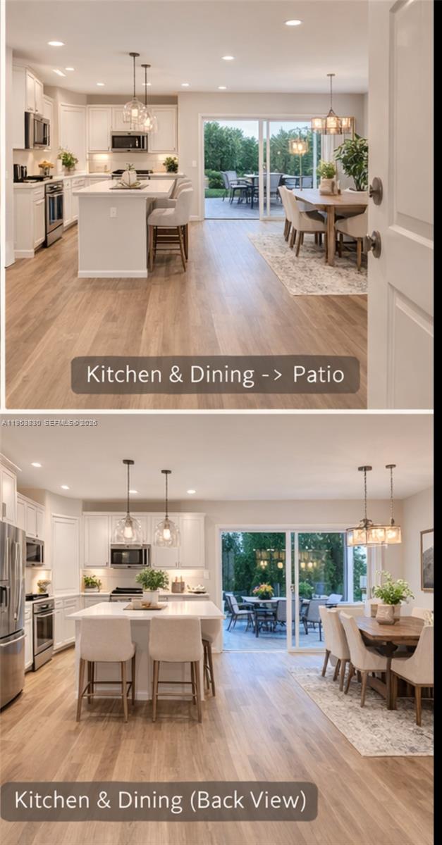 This open-concept kitchen and dining area features white cabinetry, a central island, and patio access — 2313 NW 122nd Ter, Miami FL 33167, MIAMI, FL