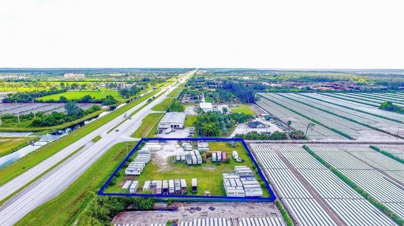 An aerial view shows a fenced rectangular lot containing several storage containers near a highway — 0 S S. State Road, Boynton Beach FL 33472, BOYNTON BEACH, FL