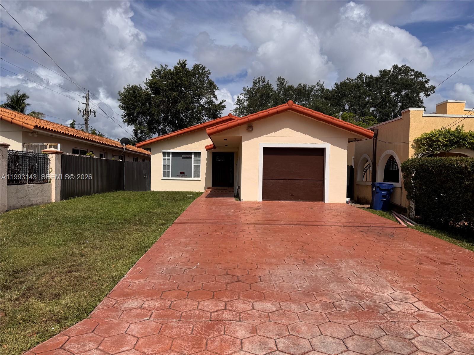 A single-story house with a red-tiled roof, a brown garage door, and a paved driveway — 2194 SW 57th Ct # 2194, Miami FL 33155, MIAMI, FL