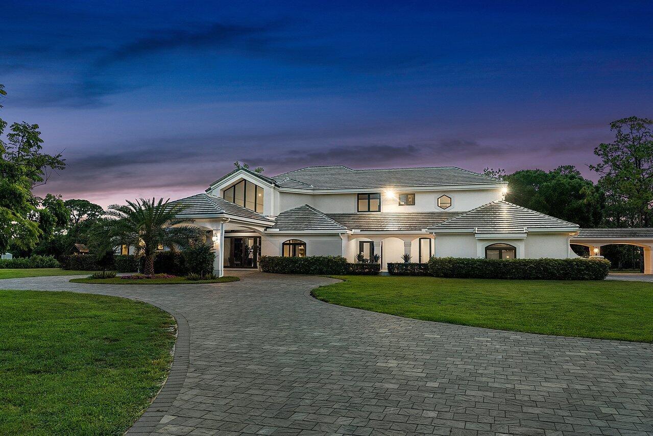 A large two-story white house with a gray tile roof and a paved circular driveway — 21677 El Bosque Way, Boca Raton FL 33428, BOCA RATON, FL