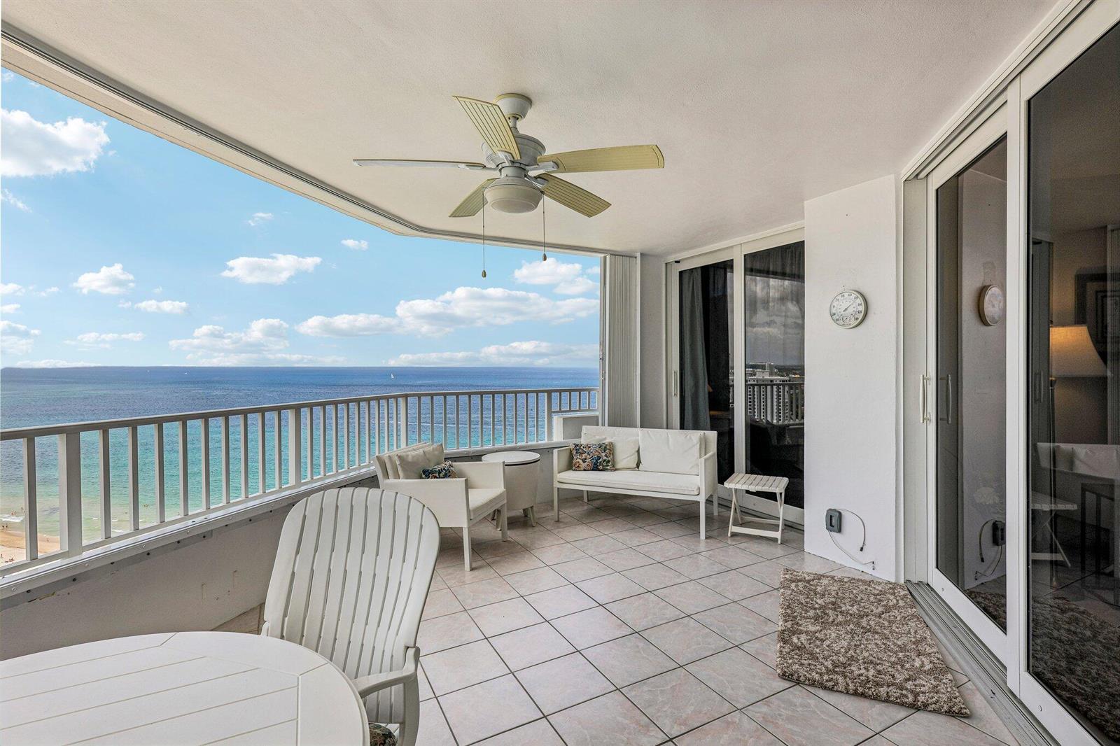 A balcony with tile flooring, outdoor furniture, a ceiling fan, and an ocean view — 1340 S Ocean Boulevard # 2303, Pompano Beach FL 33062, POMPANO BEACH, FL