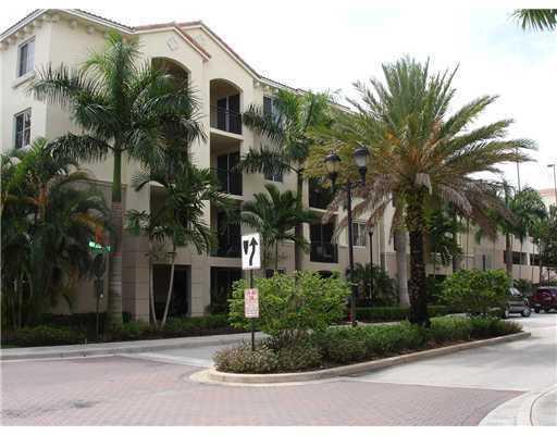 A multi-story apartment building with palm trees and a parking garage in the background — 3 Renaissance Way # 204, Boynton Beach FL 33426, BOYNTON BEACH, FL