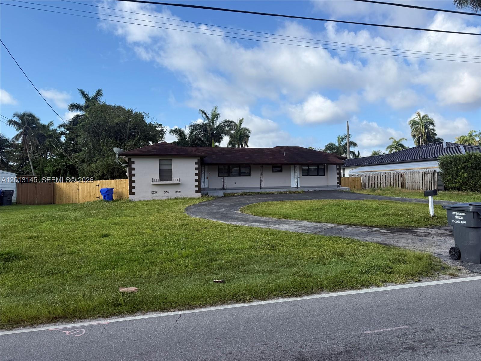 A single-story house with a curved driveway and a large front lawn — 2830 Johnson St # 1, Hollywood FL 33020, HOLLYWOOD, FL