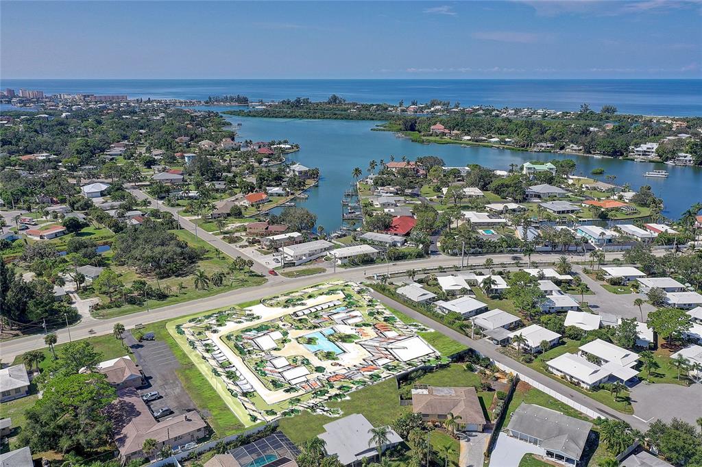 This is an aerial rendering of a proposed residential development site near a coastal waterway — 424 ALBEE ROAD W UNIT 1, NOKOMIS, FL