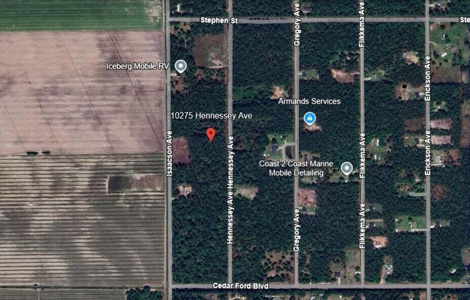 This is a satellite map view showing a wooded area with surrounding streets and businesses — 10275 Hennessey Avenue, FL 32145, FL