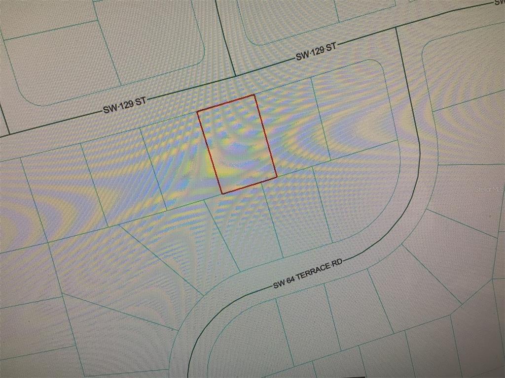 This is a map showing a rectangular property lot outlined in red — 0 SW 129 STREET, OCALA, FL
