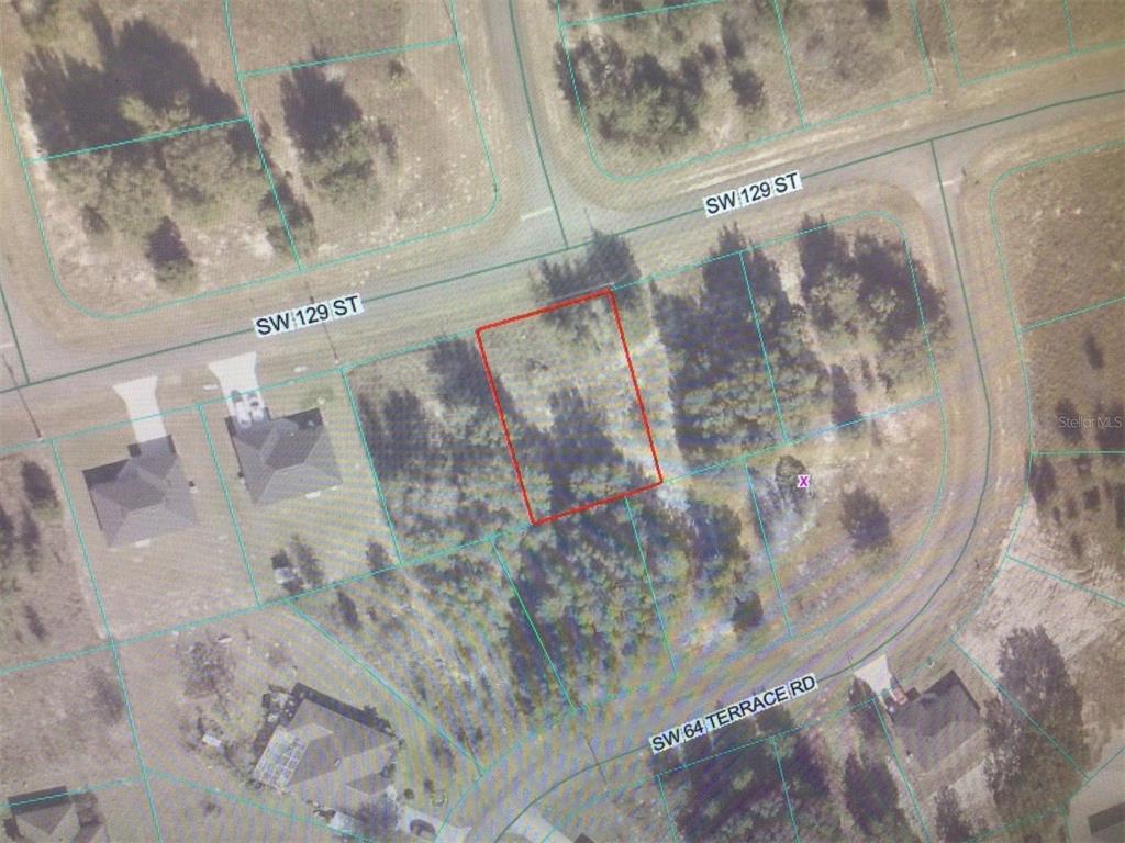 An aerial map view shows a vacant, rectangular lot outlined in red near a road intersection — 0 SW 129 STREET, OCALA, FL