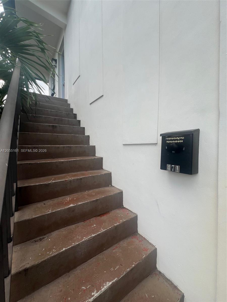 A set of concrete stairs leads up to an entrance next to a black mailbox — 467 E 13th St # 467A, Hialeah FL 33010, HIALEAH, FL