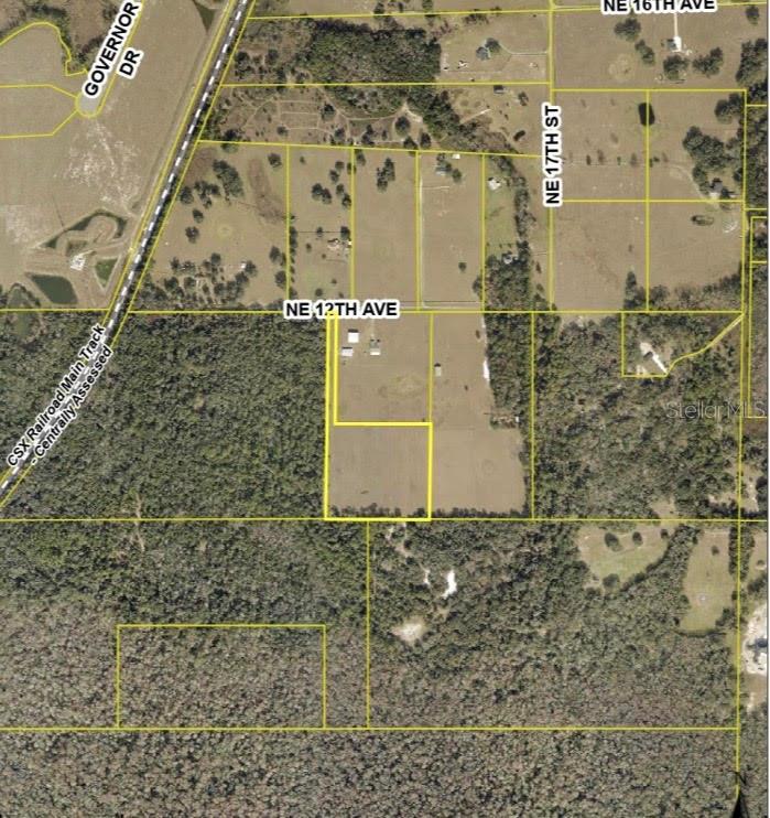 This is an aerial map showing property boundary lines overlaid on a rural landscape — 1613 NE 12TH AVENUE, SUMTERVILLE, FL