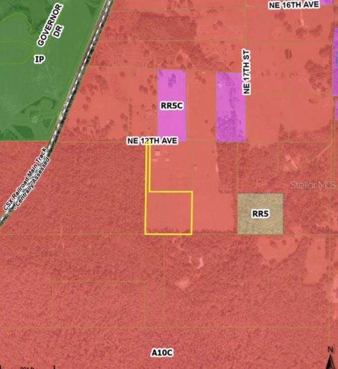This is a map showing a property parcel highlighted in yellow against various zoning districts — 1613 NE 12TH AVENUE, SUMTERVILLE, FL