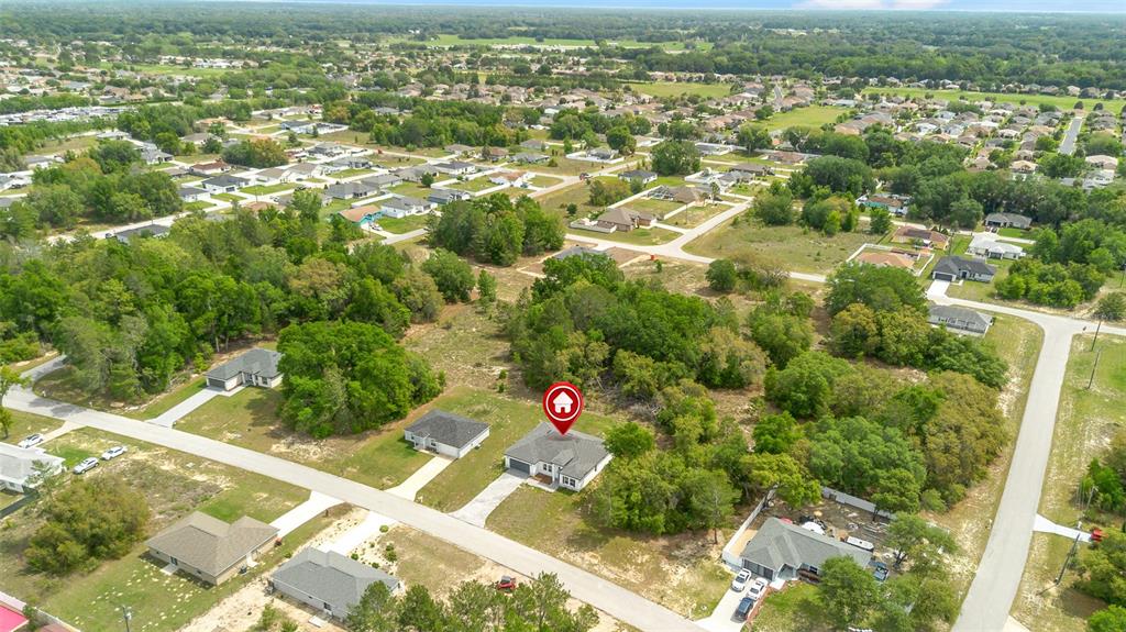 An aerial view shows a single-story house with a red location pin in a neighborhood — 16317 SW 23RD COURT ROAD, OCALA, FL