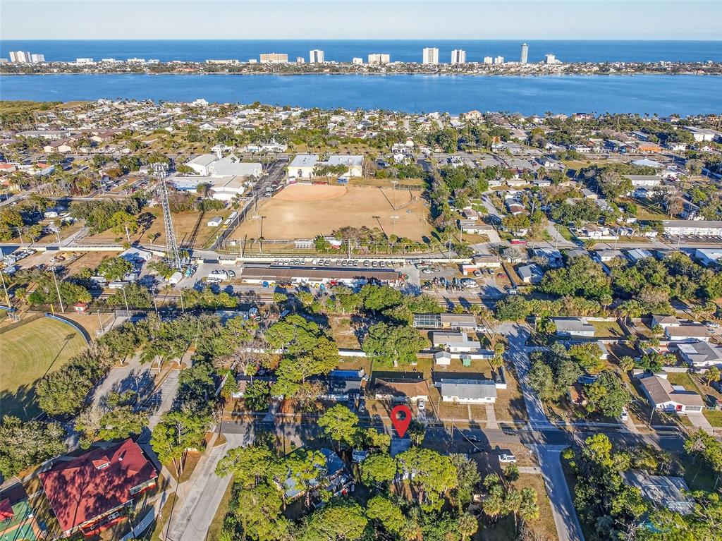 An aerial view shows a residential neighborhood with a red pin marking a specific property — 1806 JAMES STREET, SOUTH DAYTONA, FL