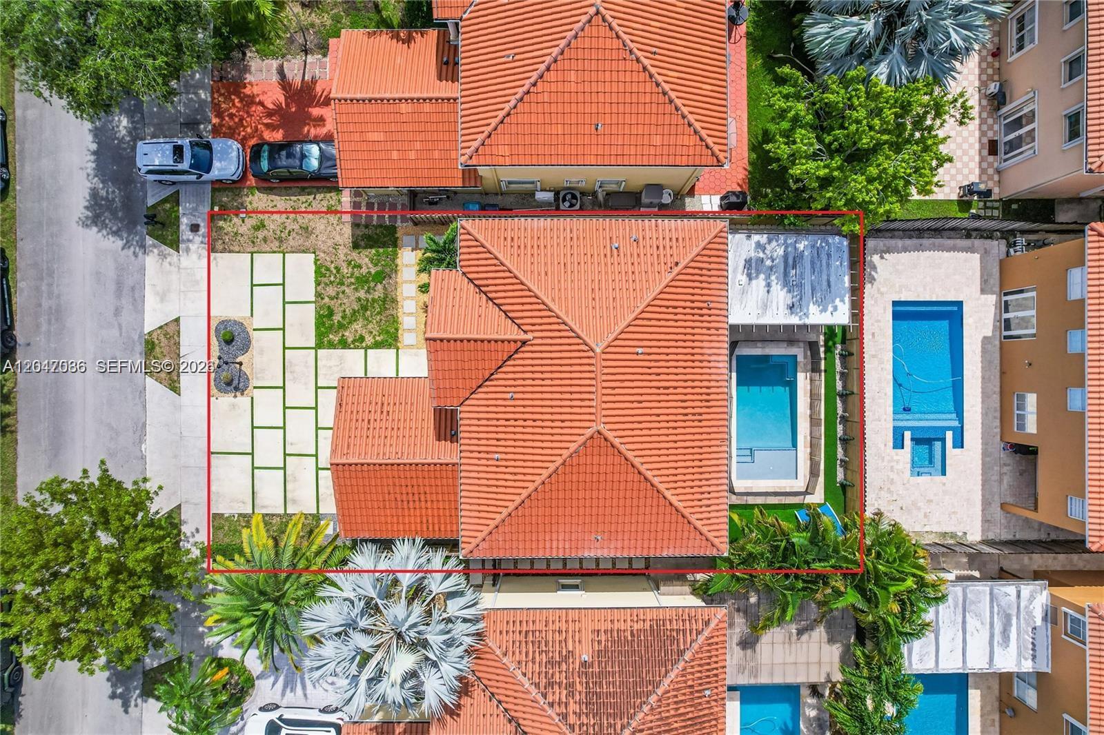 An aerial view shows a house with a red tile roof, pool, and paved yard — 15877 SW 61st Way, Miami FL 33193, MIAMI, FL