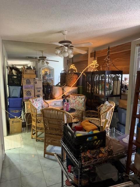 A cluttered dining area features wicker chairs, a glass-topped table, and mirrored walls — 319 3rd Way, West Palm Beach FL 33407, WEST PALM BEACH, FL