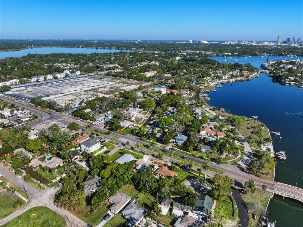 Aerial view of a residential neighborhood near a large lake and a cleared construction site — 220 45TH AVENUE S, ST PETERSBURG, FL
