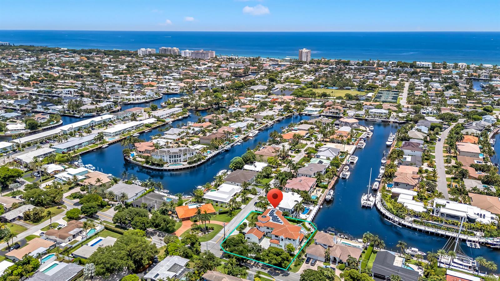 An aerial view shows a waterfront house with a red-tiled roof and a swimming pool — 2300 NE 34th Court, Lighthouse Point FL 33064, LIGHTHOUSE POINT, FL