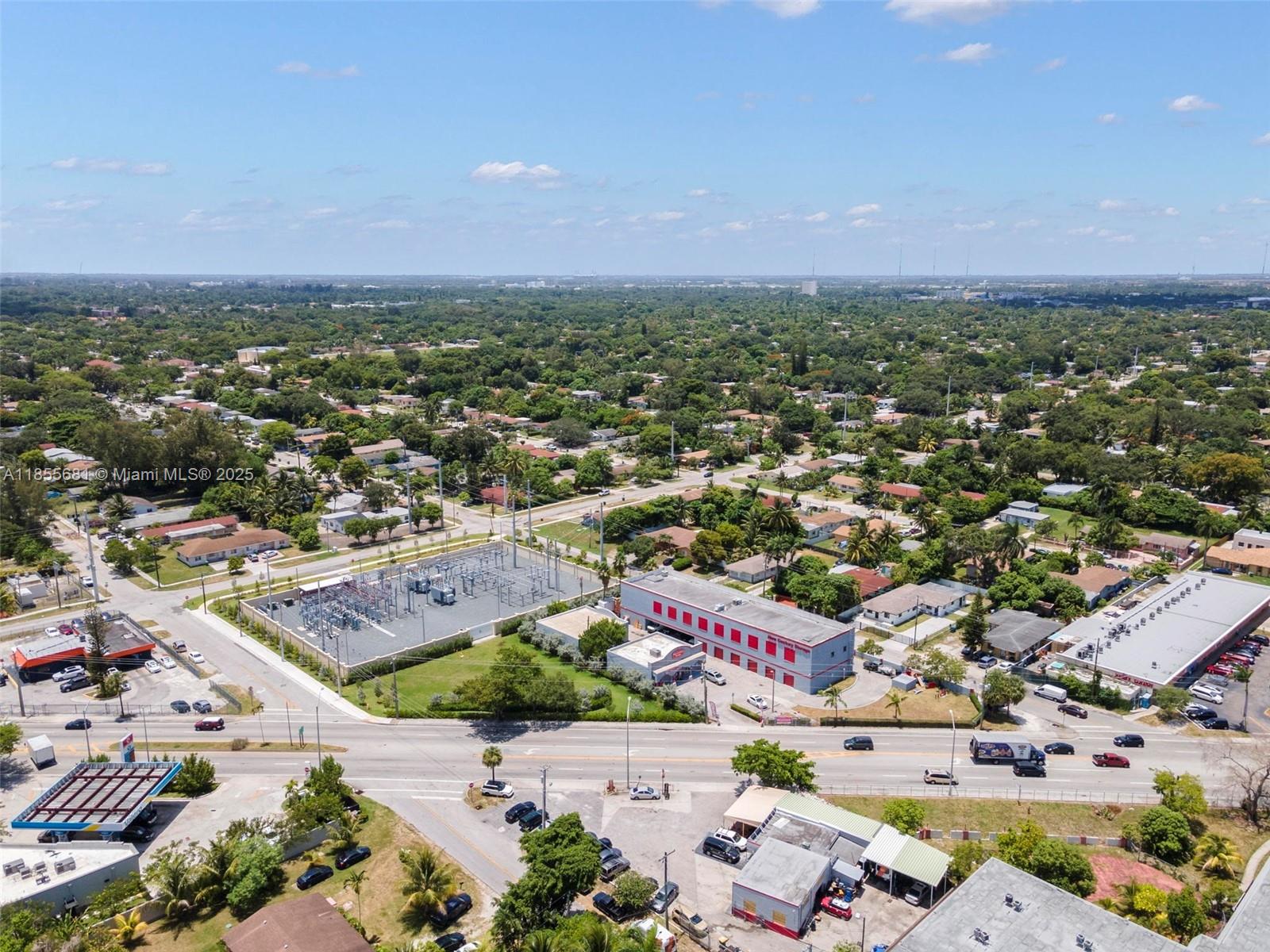 An aerial view shows a suburban area with a power substation, commercial buildings, and roads — 14444 W Dixie Hwy, Miami FL 33161, MIAMI, FL