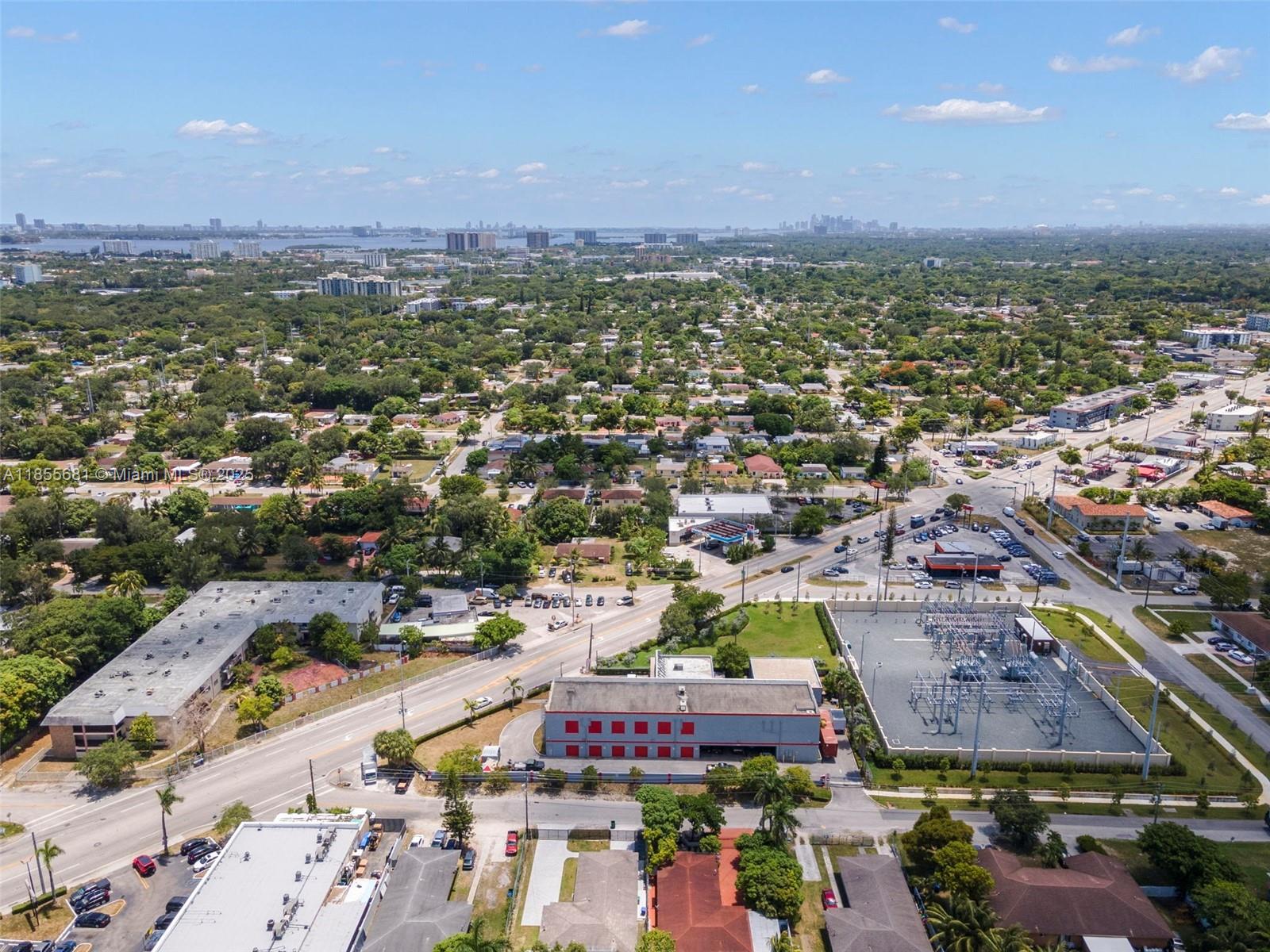 An aerial view shows a suburban landscape with a power substation, commercial buildings, and roads — 14444 W Dixie Hwy, Miami FL 33161, MIAMI, FL