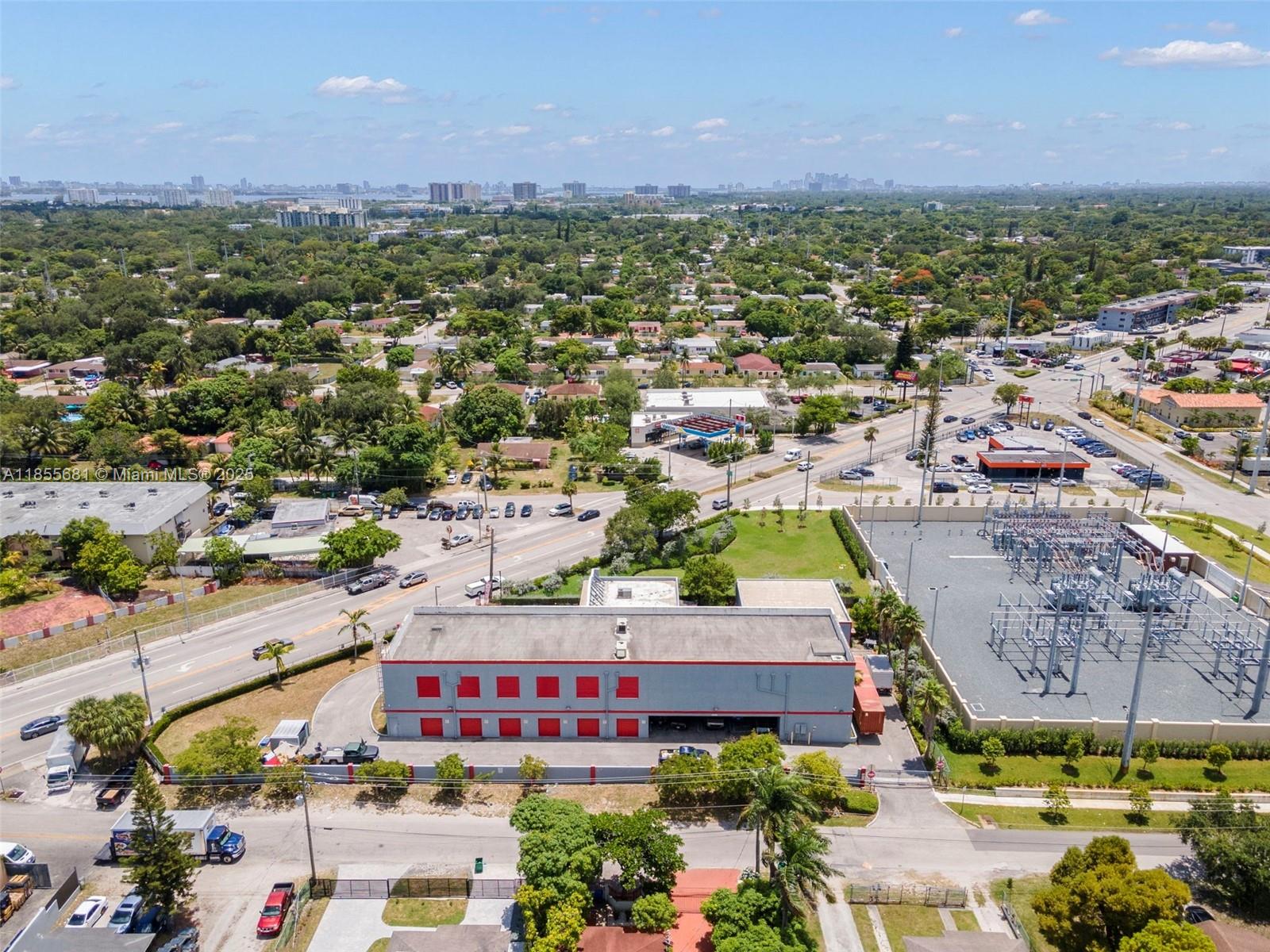 An aerial view shows a rectangular storage facility with red doors next to an electrical substation — 14444 W Dixie Hwy, Miami FL 33161, MIAMI, FL