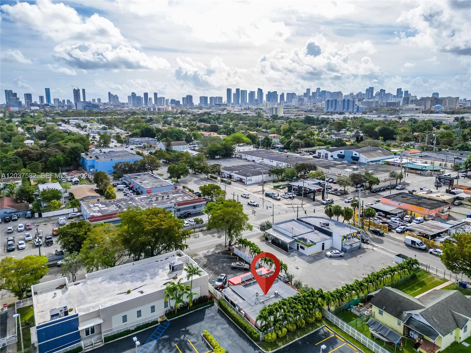 An aerial view shows a commercial building with a red location pin in a city — 2928 NW 17th Ave, Miami FL 33142, MIAMI, FL