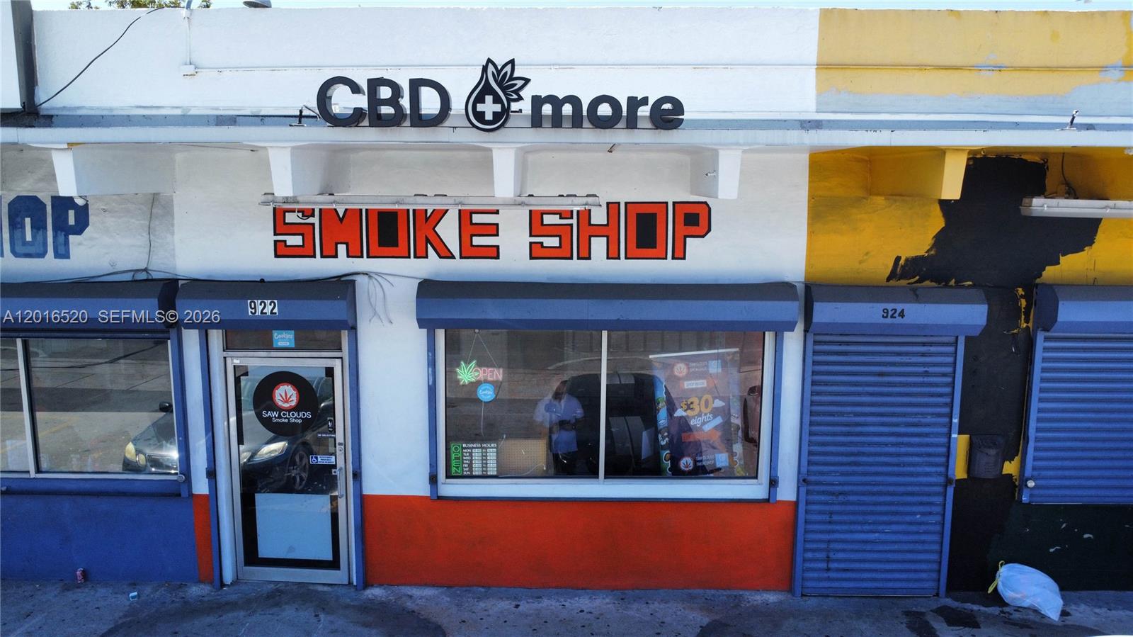 The exterior of a commercial storefront features a sign reading CBD and more smoke shop — 922 NW 36th st, Miami FL 33127, MIAMI, FL