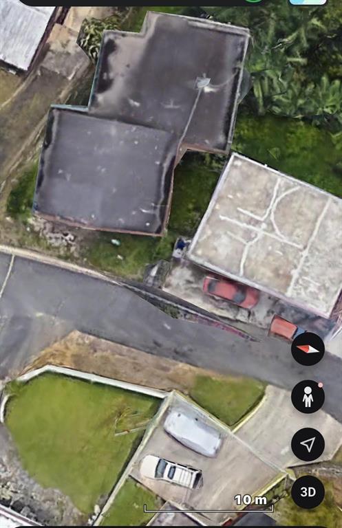 This aerial view shows two residential buildings with flat roofs and adjacent paved parking areas — 487 EXT. VILLA DEL RIO, TOA ALTA, PR