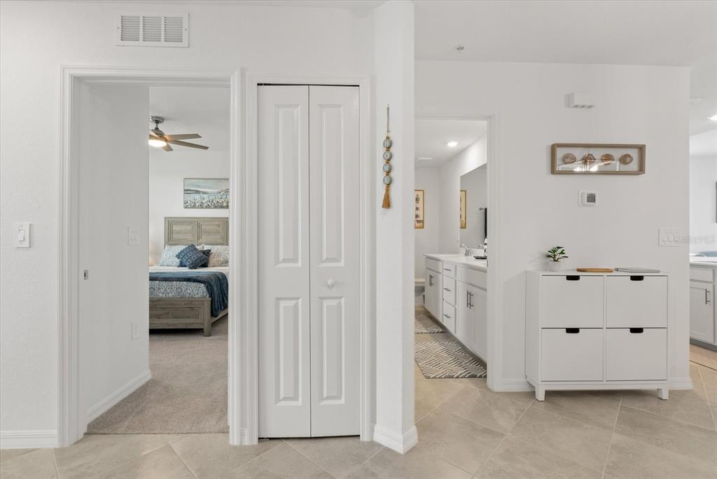 A hallway leads to a bedroom on the left and a bathroom on the right — 17570 OPAL SAND DRIVE UNIT 201, VENICE, FL