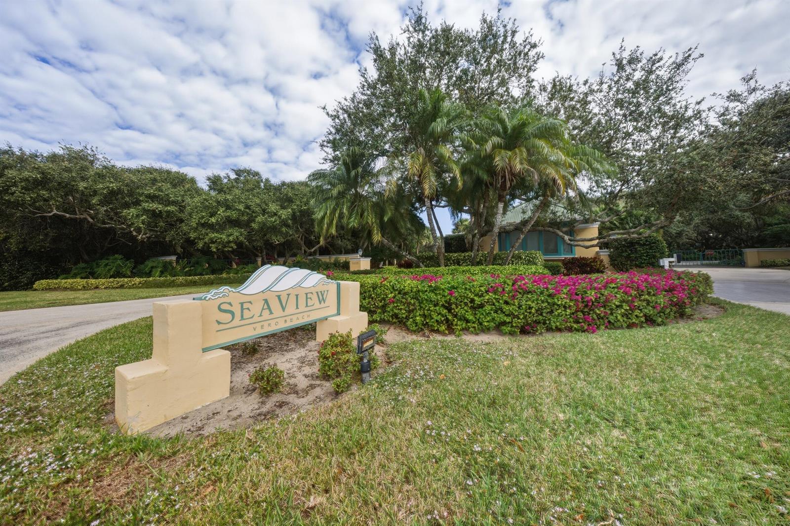 A sign for Seaview in Vero Beach stands in front of lush landscaping and trees — 11740 Seaview Drive, Vero Beach FL 32963, VERO BEACH, FL