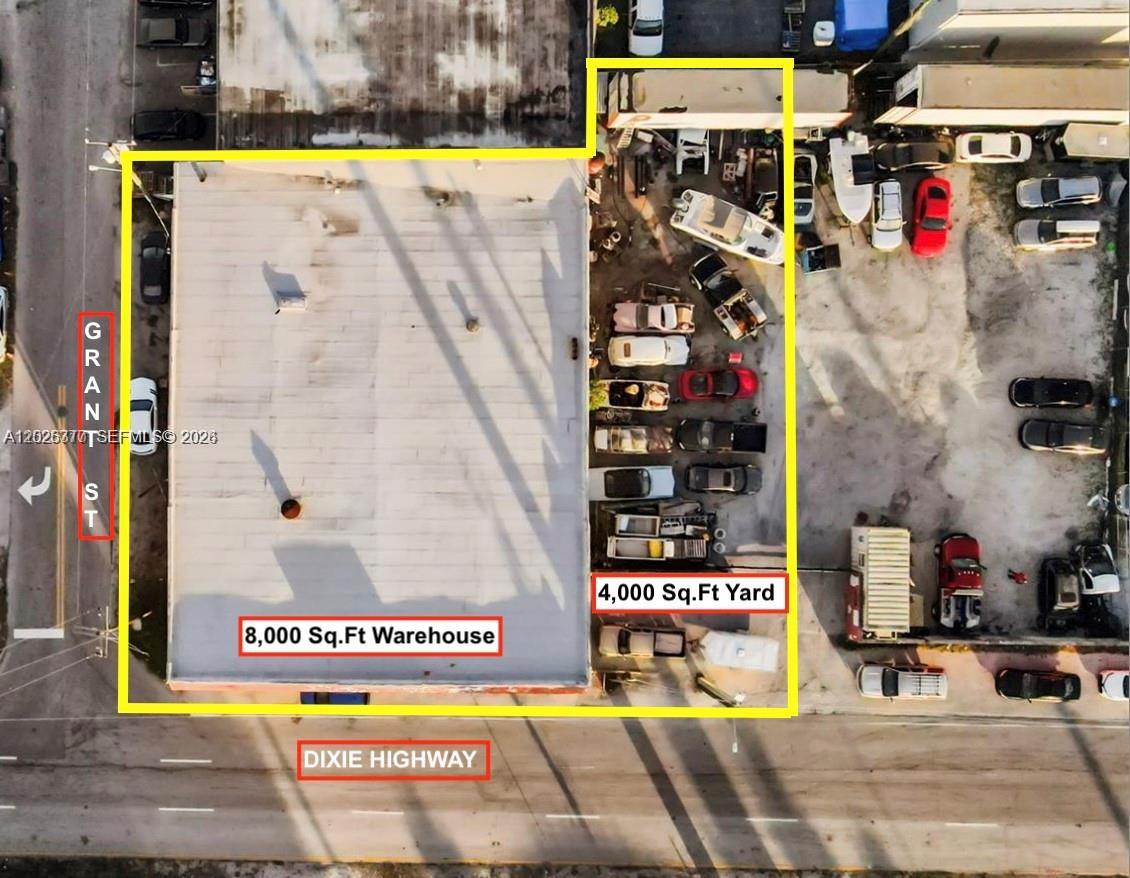 Aerial view of a warehouse and adjacent yard located at a street corner — 921 N 21st Ave, Hollywood FL 33020, HOLLYWOOD, FL