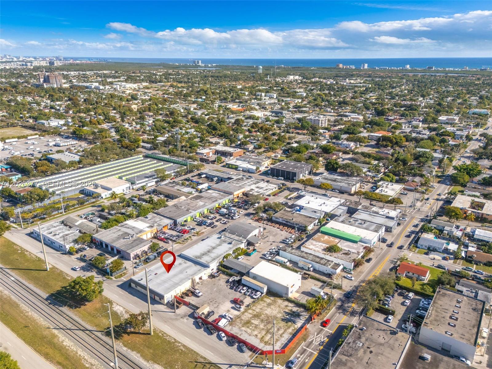 An aerial view shows a commercial building with a red location pin in a neighborhood — 921 N 21st Ave, Hollywood FL 33020, HOLLYWOOD, FL