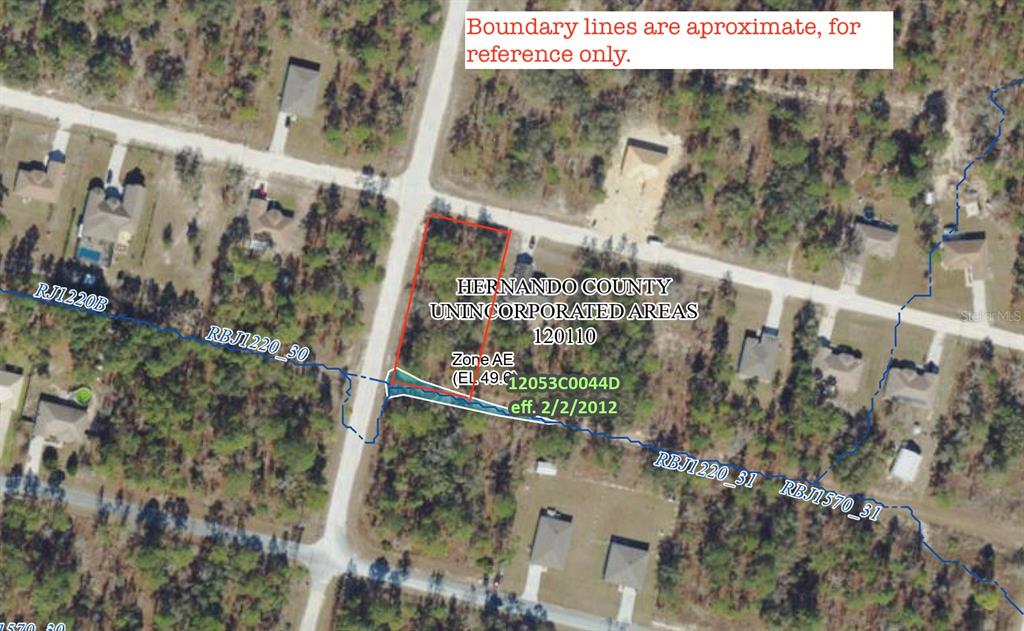 This is an aerial map showing a vacant lot with property boundaries and flood zone information — 15282 IBIS ROAD, BROOKSVILLE, FL