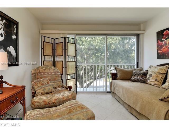 A furnished living area features a daybed, an armchair with an ottoman, and a folding screen — OTHER CITY - IN THE STATE OF FLORIDA, FL